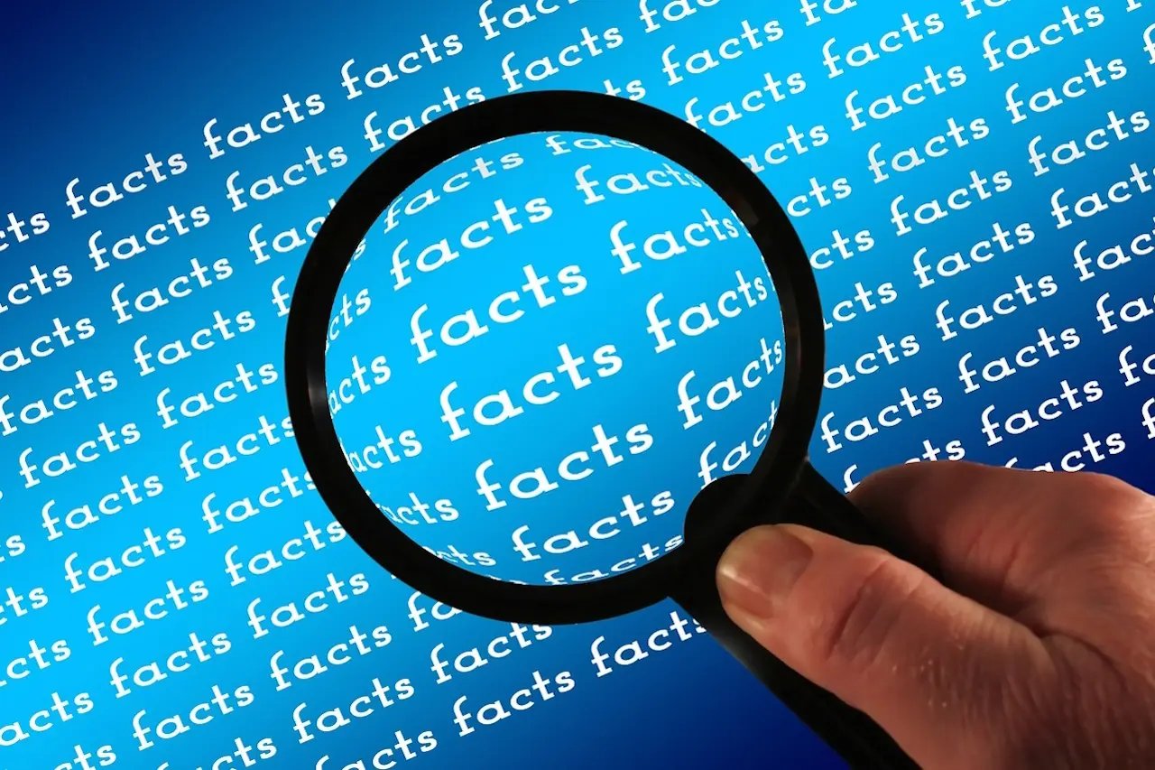 magnifying glass looking at facts